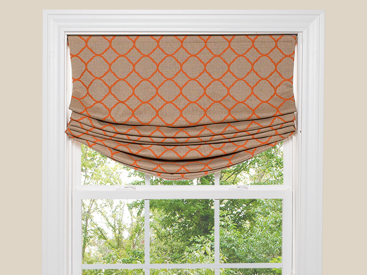 Relaxed Roman shade with a soft dip in the center and stacked pleats